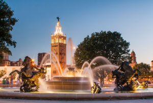 Building with a fountain in front of it