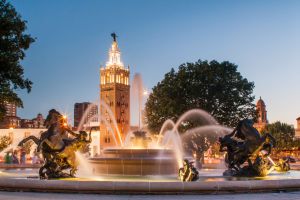 Building with a fountain in front of it